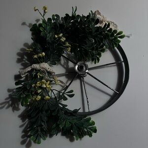 Decorative Greenery Wheel Wreath. 10” around.  Actual small bike wheel.